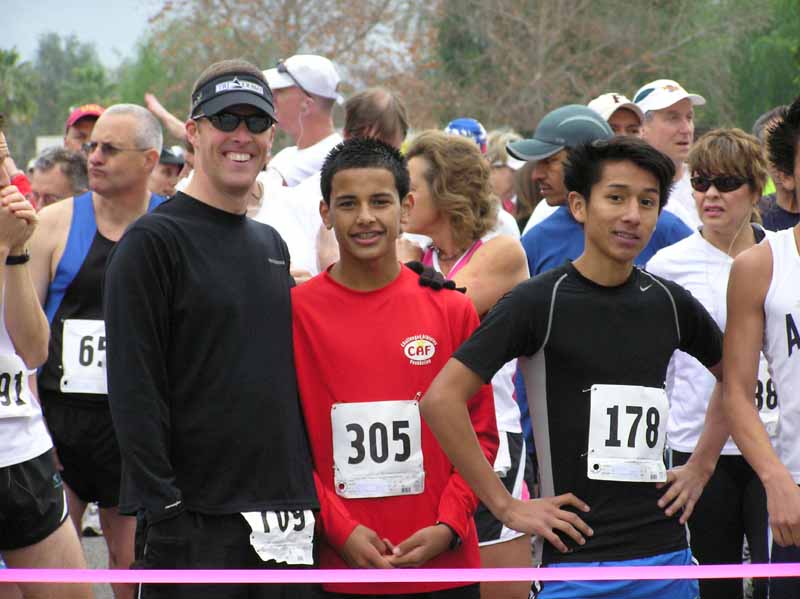 240-Half-marathoners Mike, Josh and Miguel - Mike, one of our super volunteers, finished fifth overall
